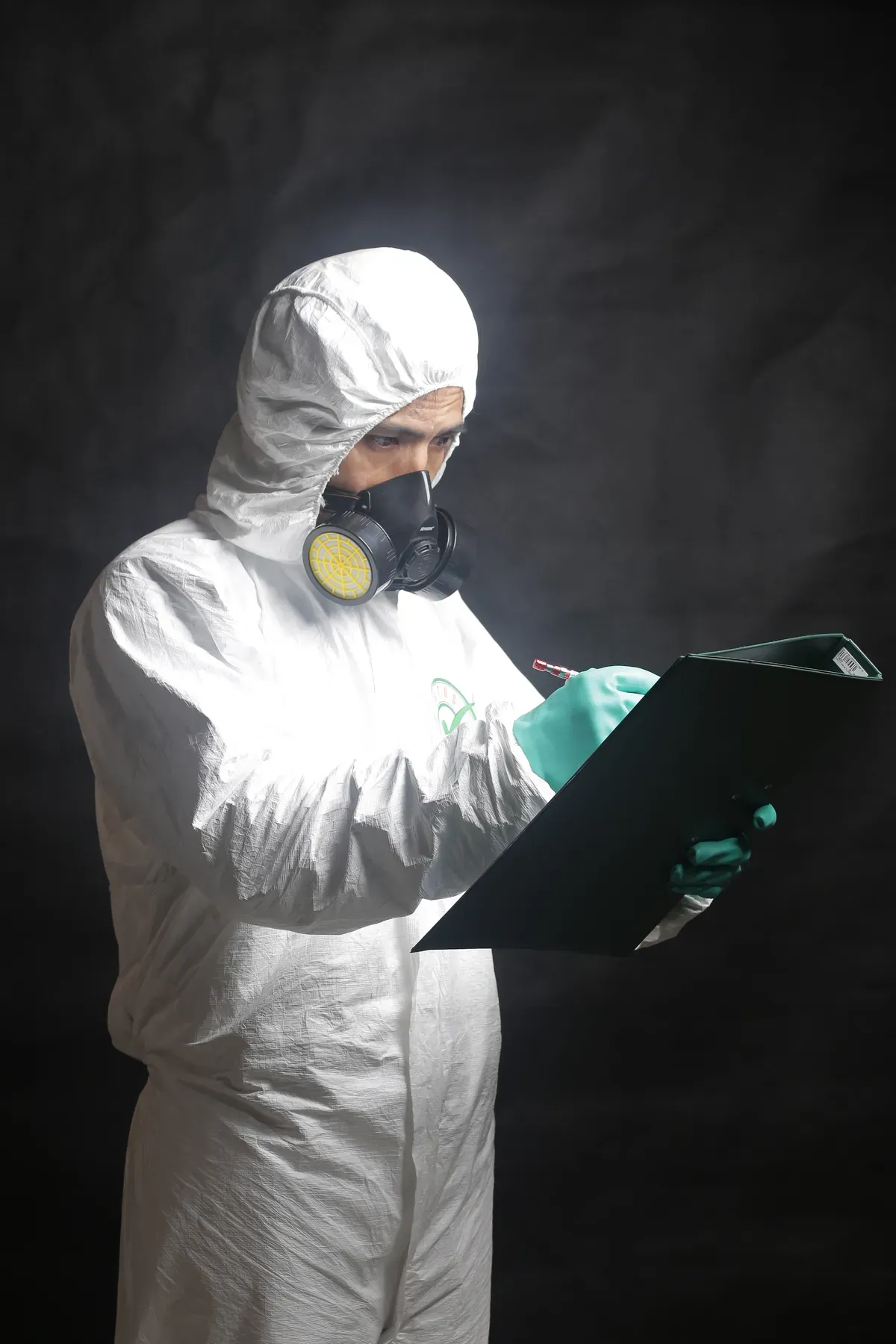 Advisor recording assessment findings on a clipboard